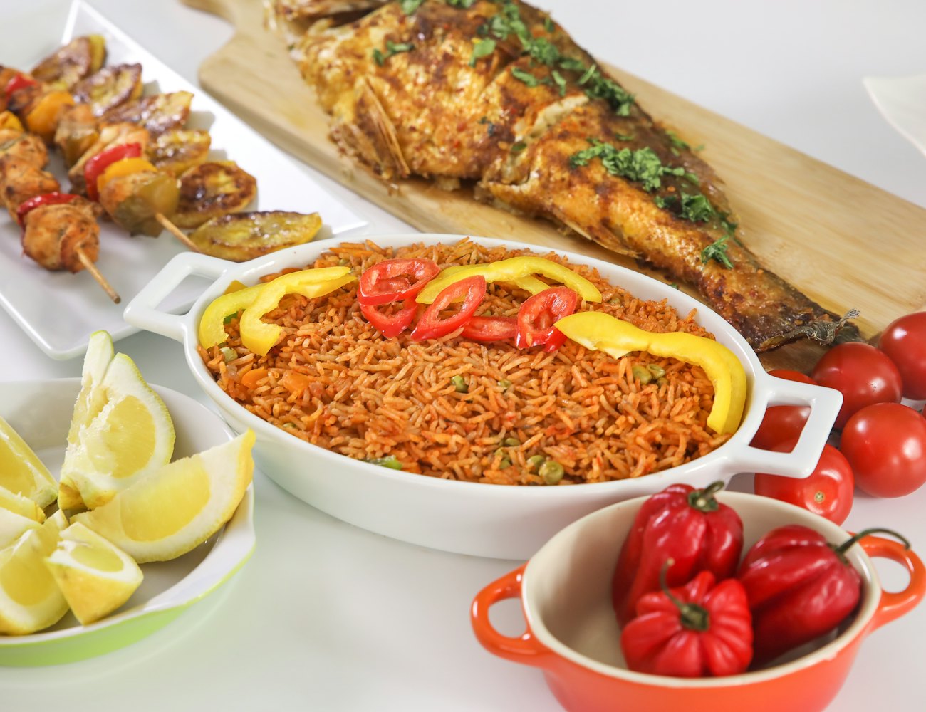 Rice with grilled chicken, fish and skewers