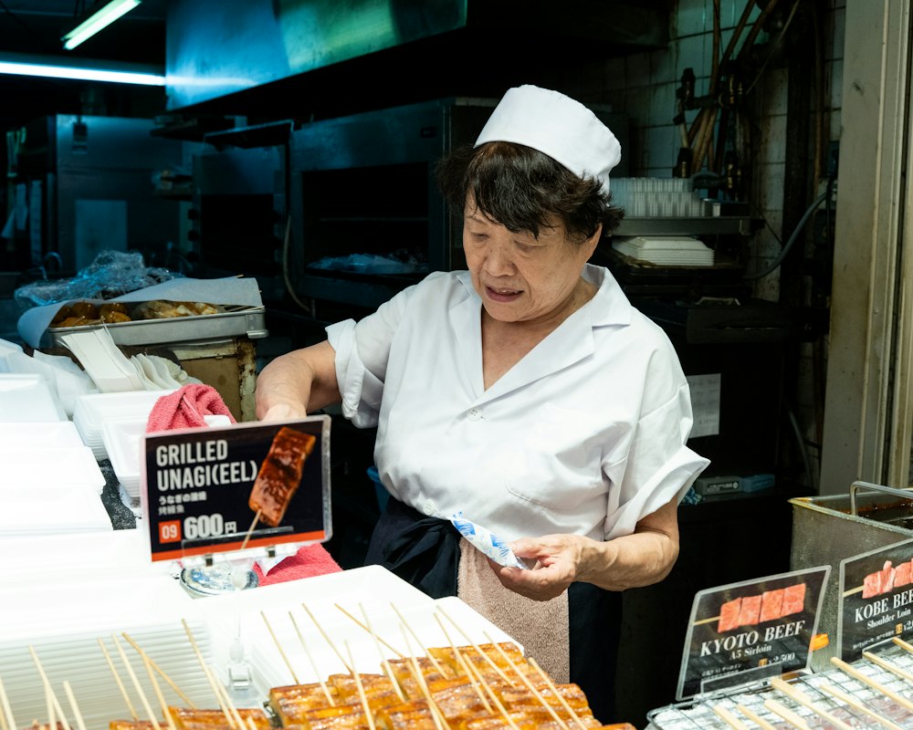 Grill stall serving skewers at a market